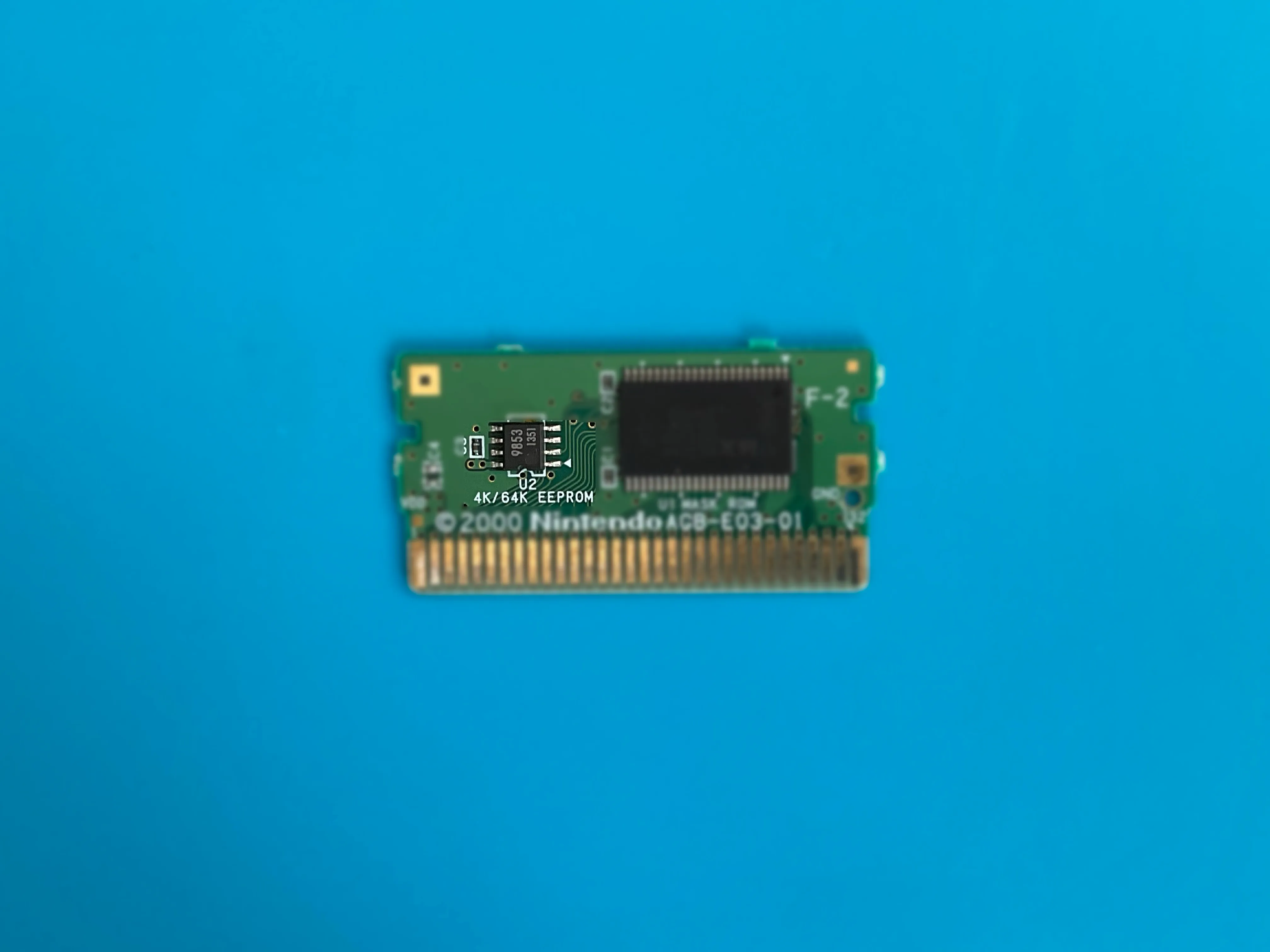 EEPROM chip, noticeably smaller than other memory types